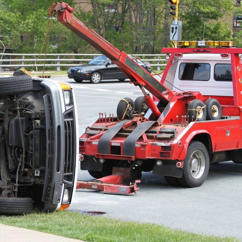 Tow truck assisting at accident